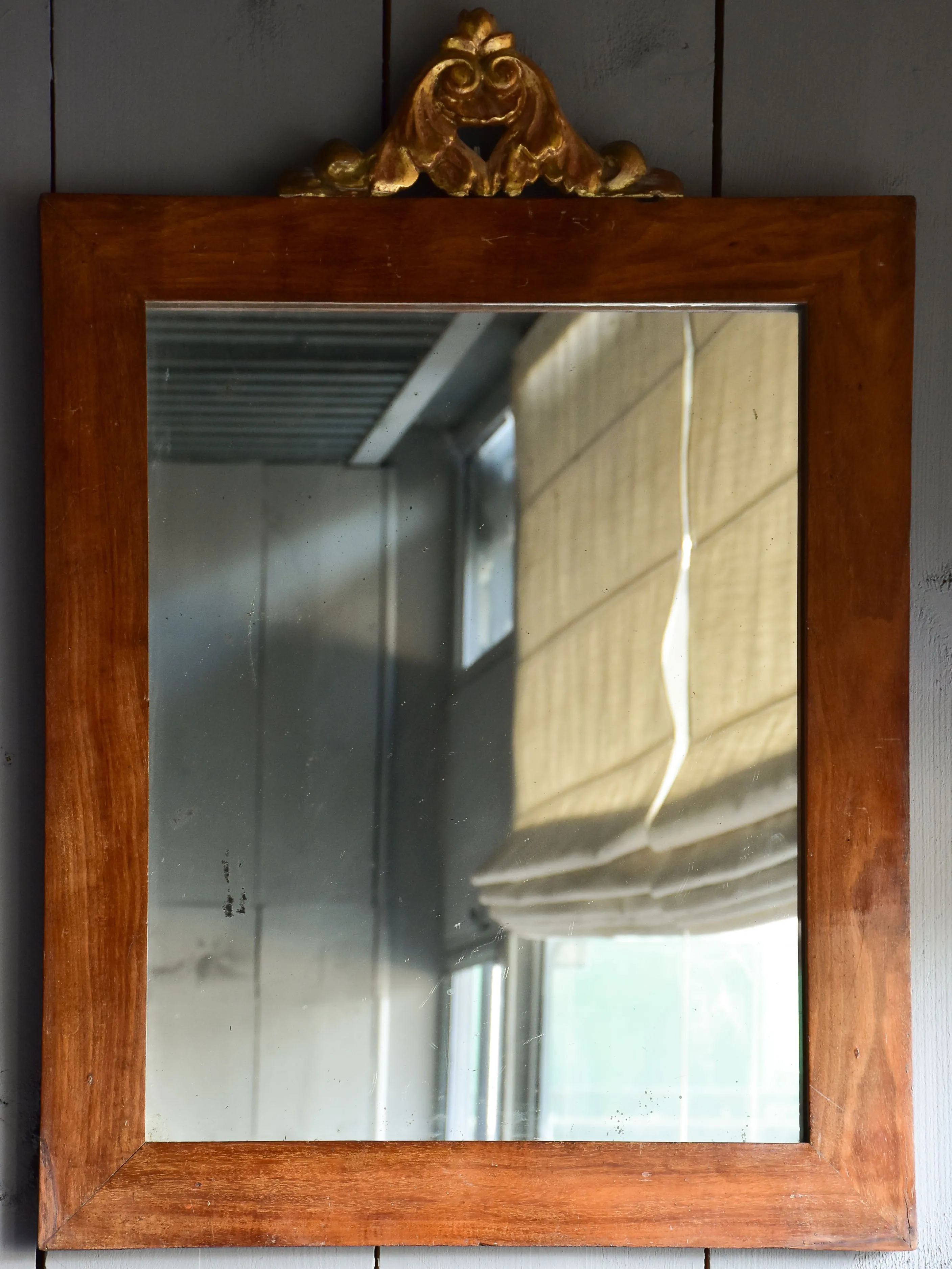Pair of antique Italian mirrors with mahogany frames and gilded crests 23 ¼'' x 32 ¾''
